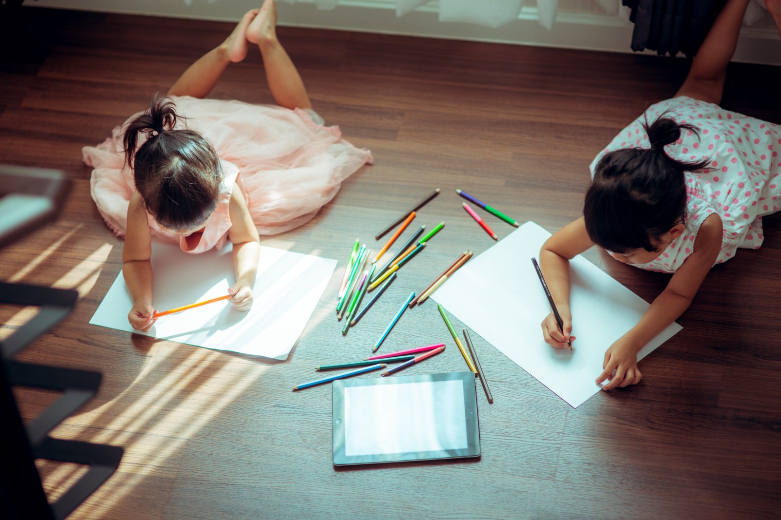 Kids drawing on floor on paper.vintage color